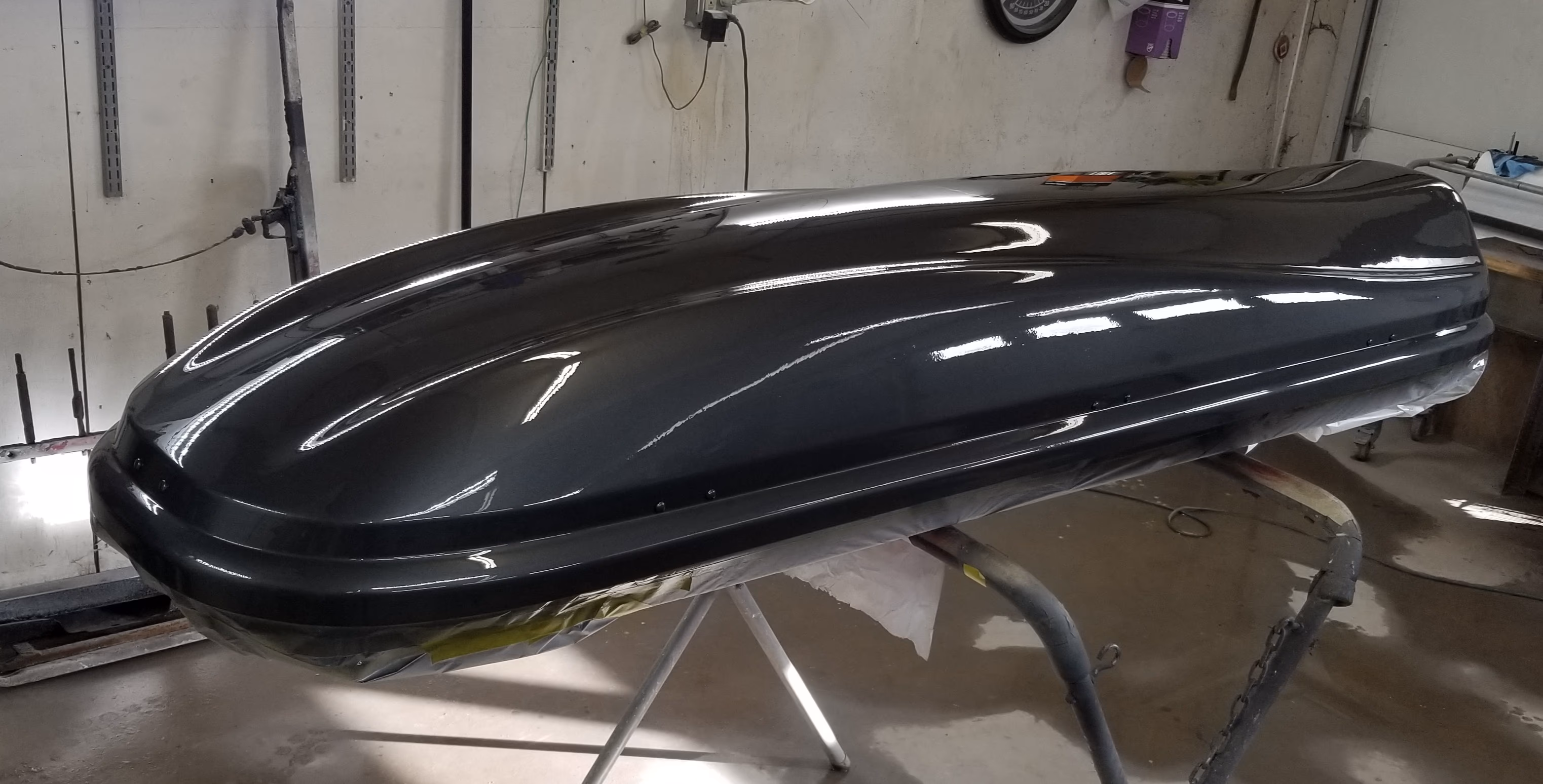 Roof-mounted cargo box repainted to match the customer's car by JRB Autobody