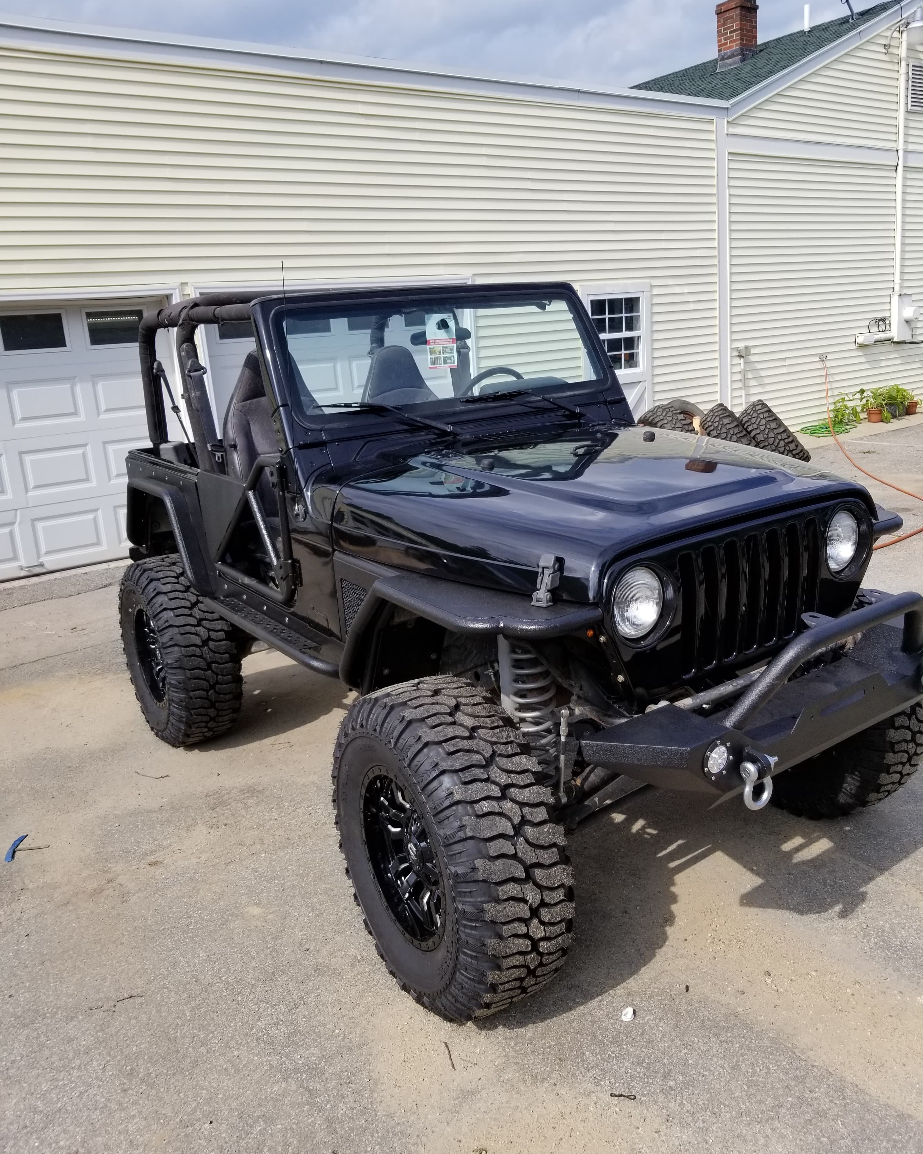 Jeep Wrangler with dent repair, full repaint, and new wheels by JRB Autobody